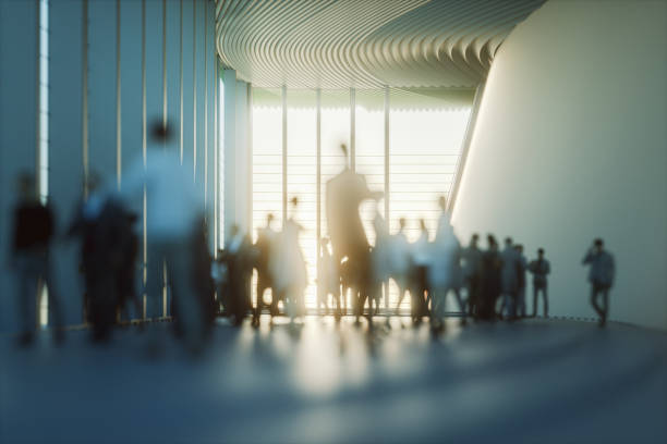 People walking in a modern office lobby, symbolizing business activity in the UAE.